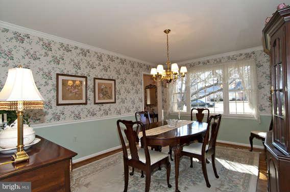 3721 Ligon Road Ellicott City, MD 21042 - Photo 5 of 30 a dining room with furniture a chandelier and window