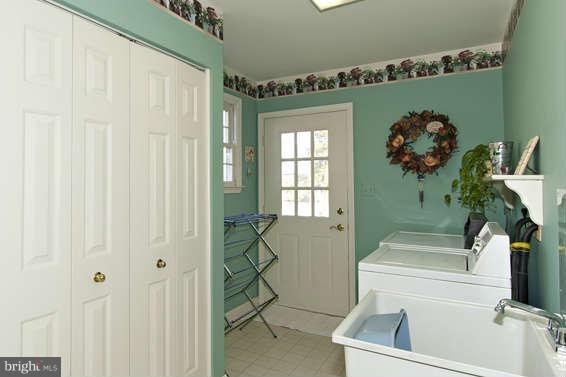 3721 Ligon Road Ellicott City, MD 21042 - Photo 9 of 30 a bathroom with a sink toilet and shower