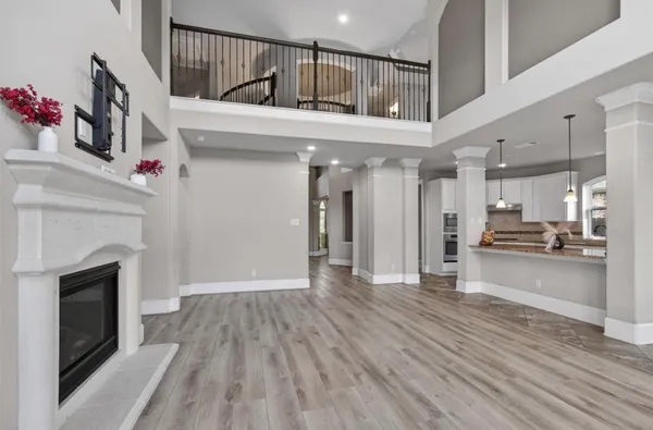 a view of a backyard with a slide trees and wooden fence