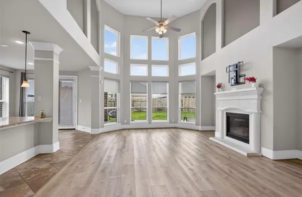 an empty room with windows and closet