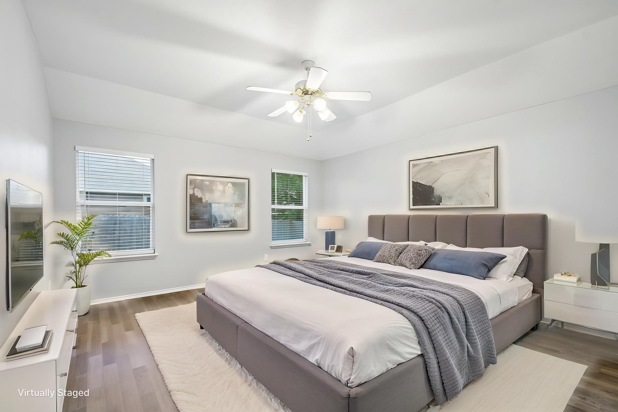 205 Cavalry Trail Elgin, TX 78621 - Photo 17 of 32 a bedroom with a bed and a chandelier