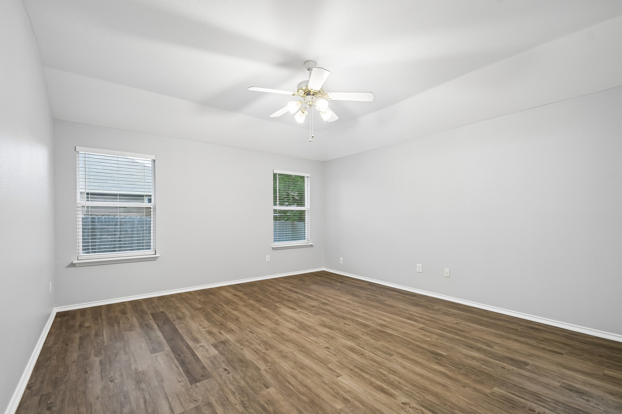 205 Cavalry Trail Elgin, TX 78621 - Photo 18 of 32 wooden floor in an empty room with a window