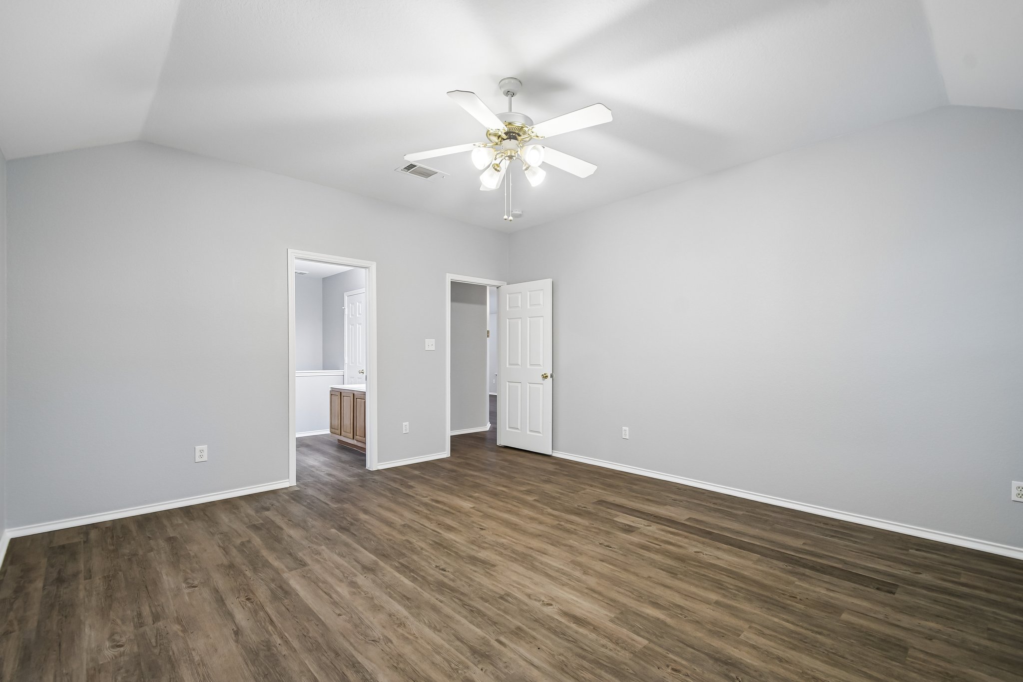 205 Cavalry Trail Elgin, TX 78621 - Photo 19 of 32 a view of an empty room with wooden floor