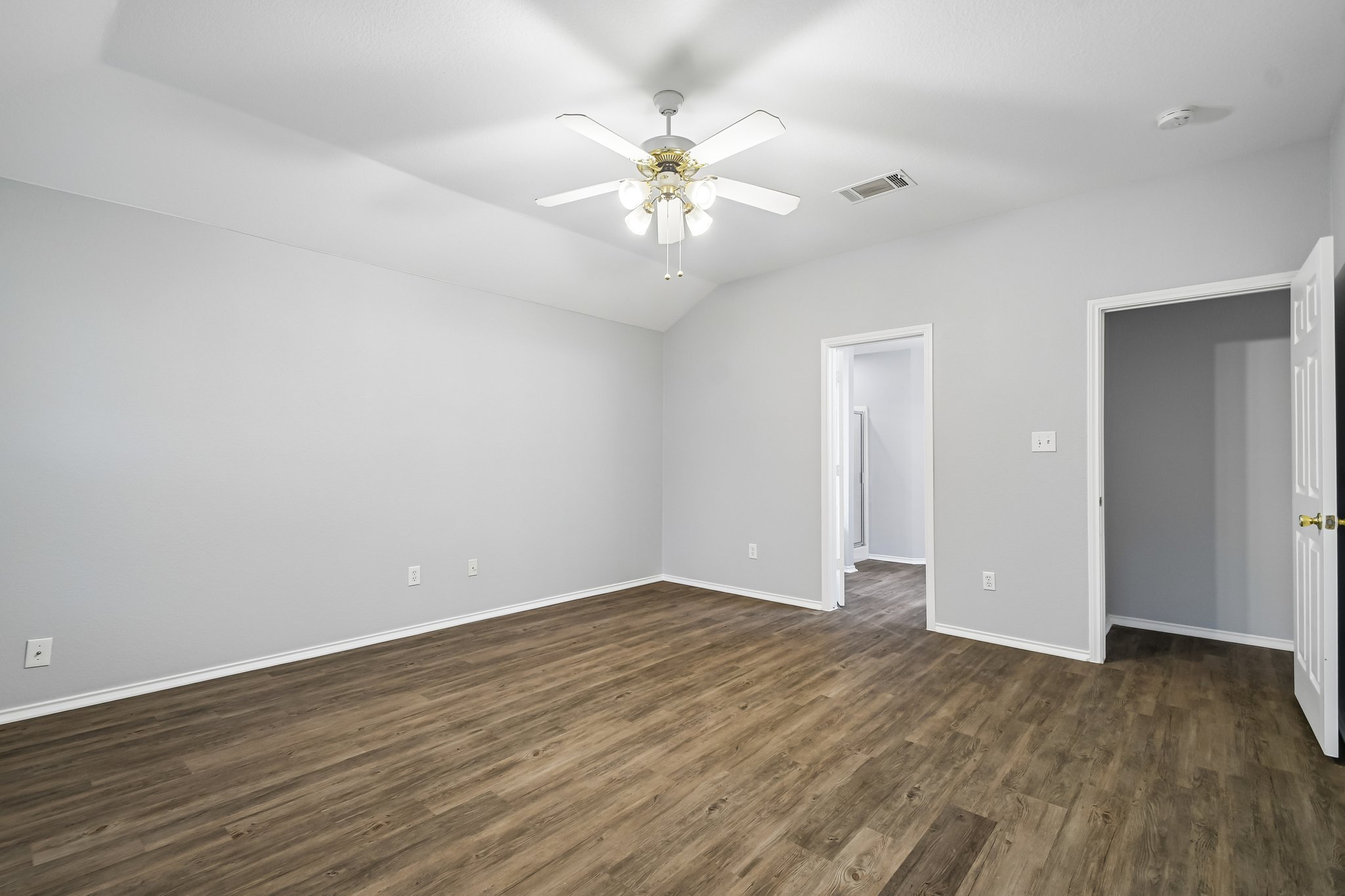 205 Cavalry Trail Elgin, TX 78621 - Photo 20 of 32 a view of an empty room with wooden floor