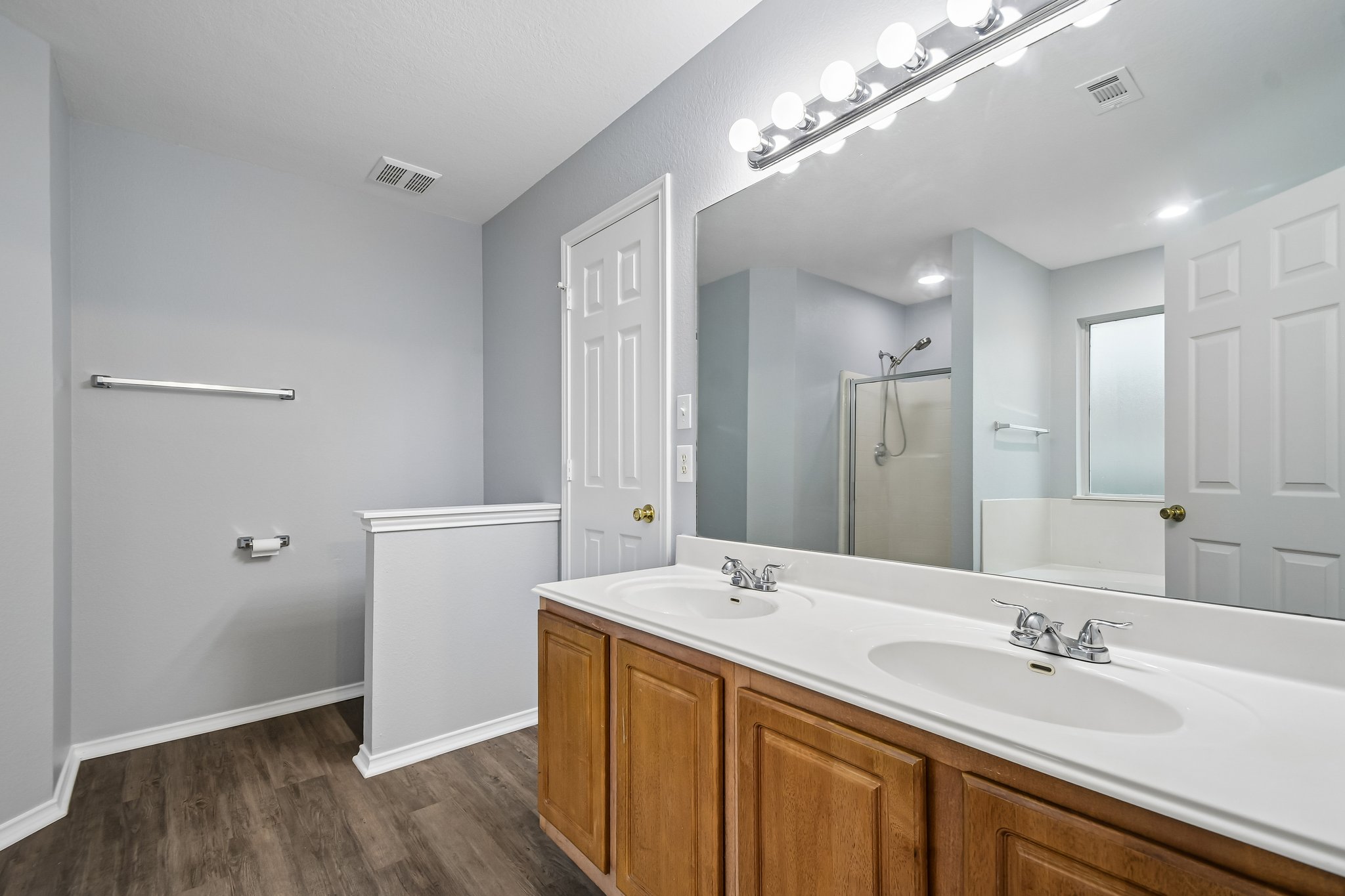205 Cavalry Trail Elgin, TX 78621 - Photo 21 of 32 a bathroom with a double vanity sink and a mirror