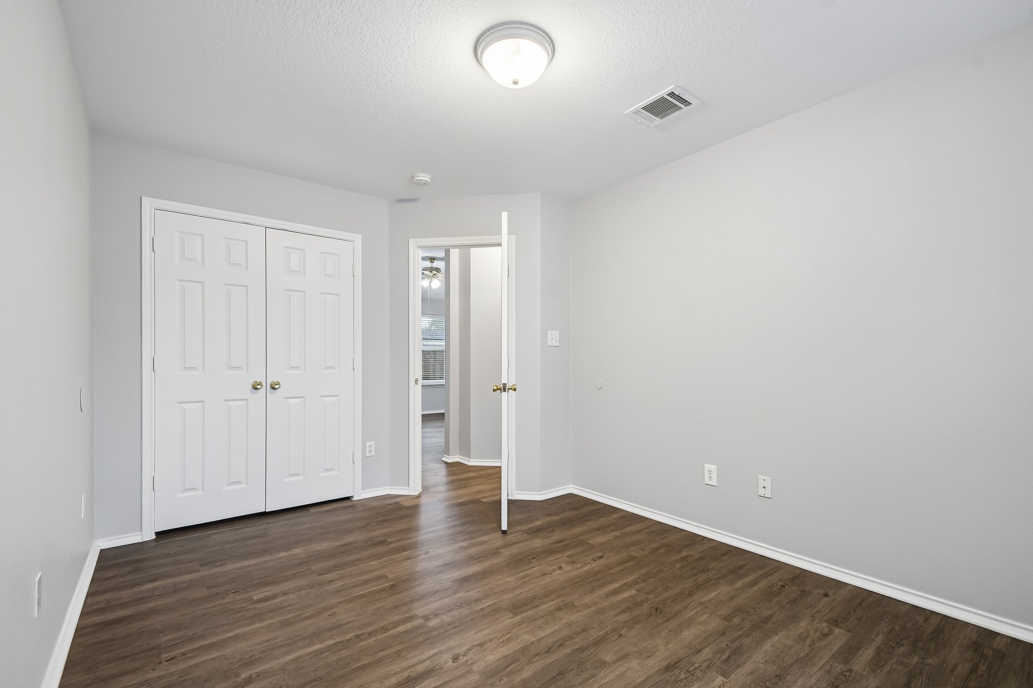 205 Cavalry Trail Elgin, TX 78621 - Photo 25 of 32 a view of an empty room with wooden floor