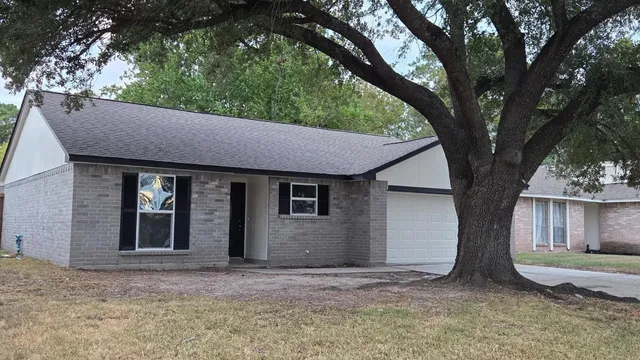 a view of house with yard