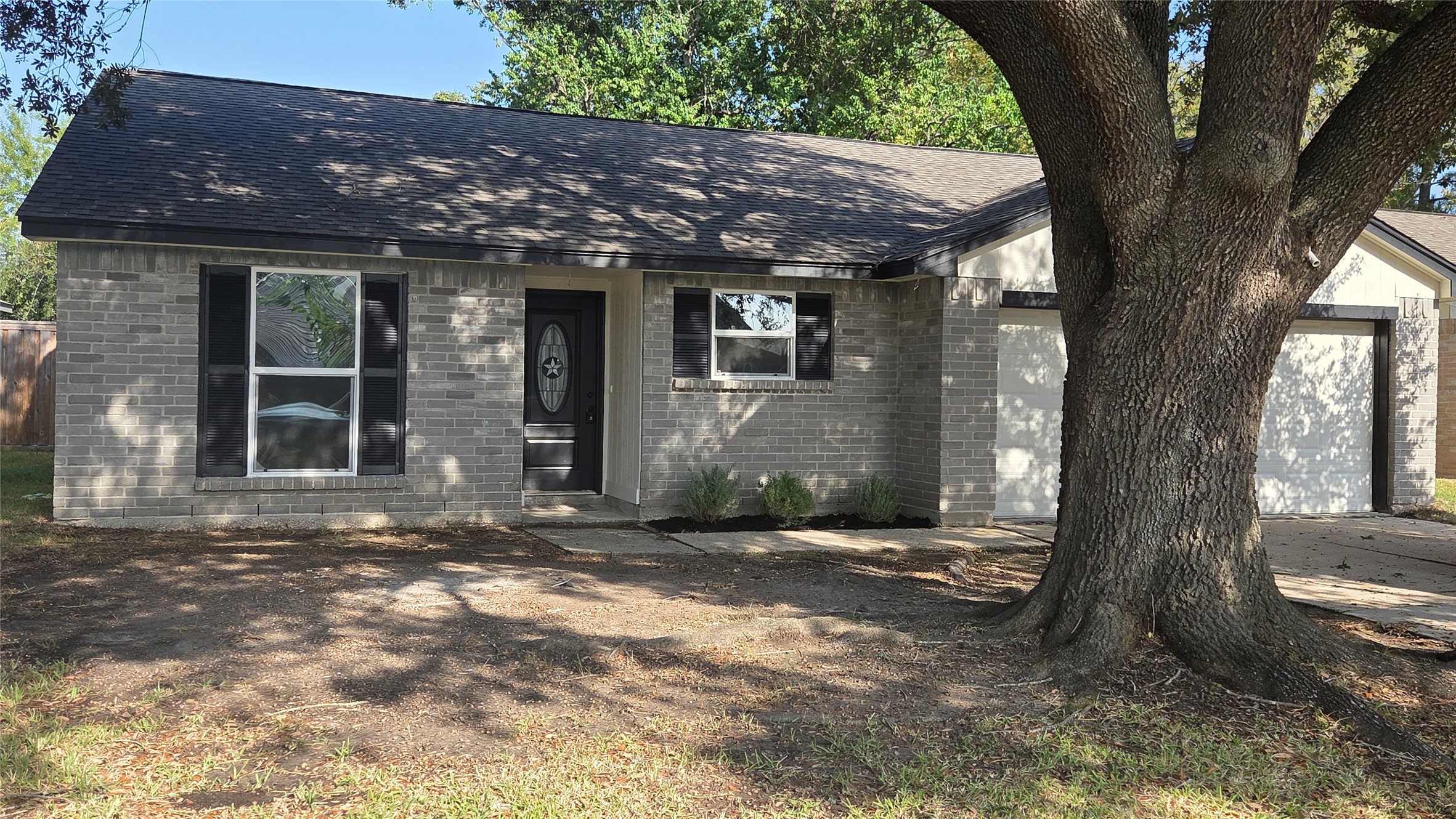 4815 Hickorygate Drive Spring, TX 77373 - Photo 3 of 16 a view of a house with a tree in the background