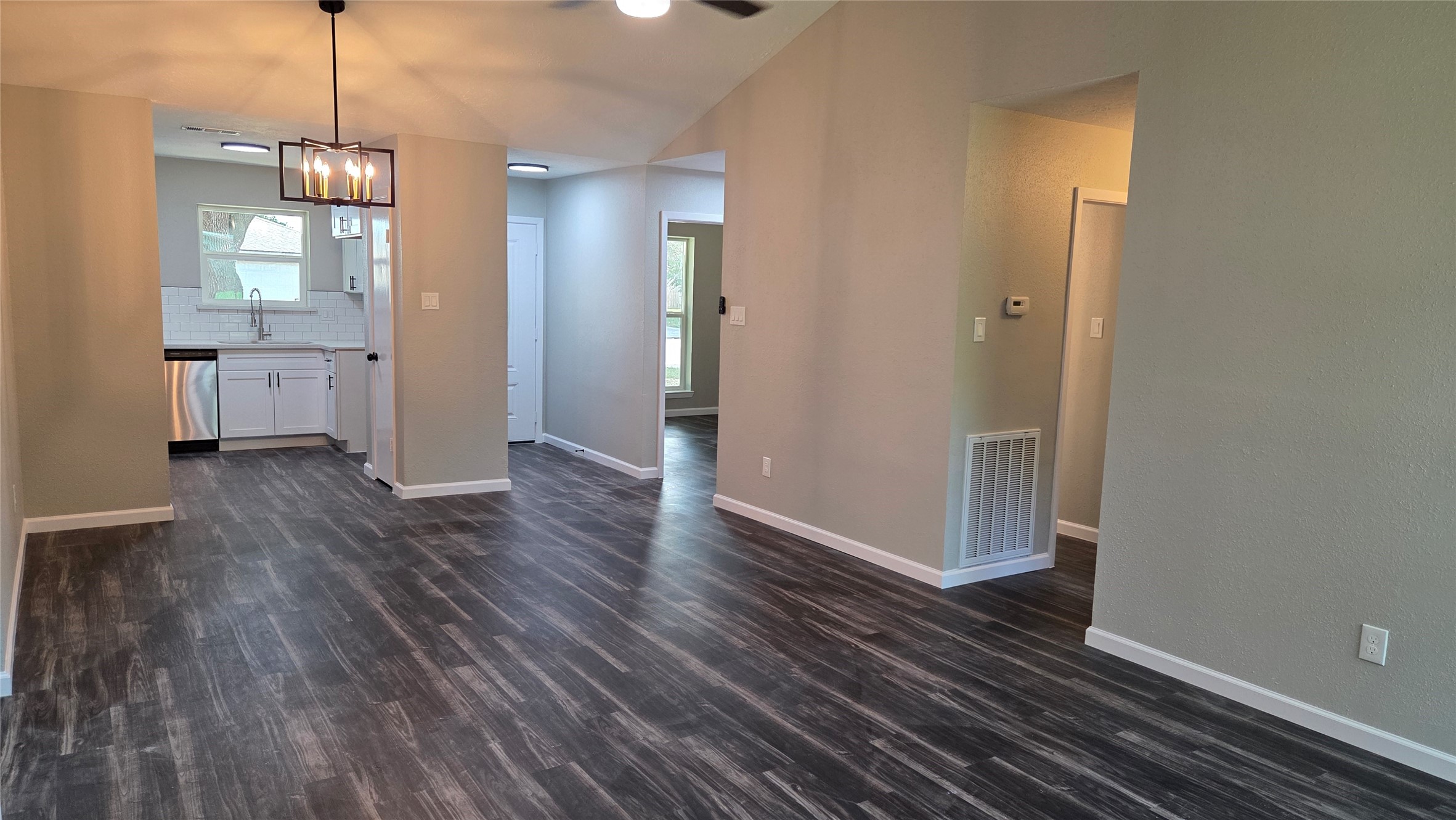 4815 Hickorygate Drive Spring, TX 77373 - Photo 5 of 16 a view of a room with wooden floor and a kitchen