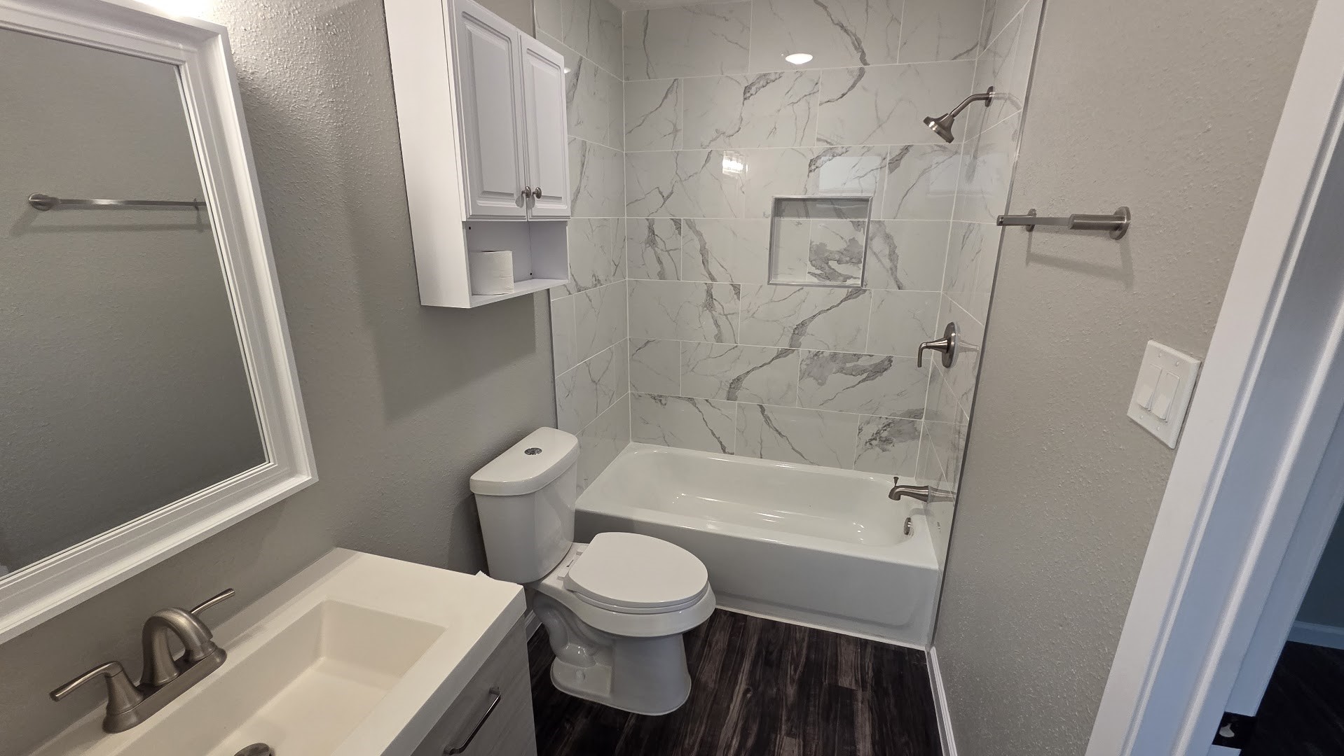4815 Hickorygate Drive Spring, TX 77373 - Photo 9 of 16 a bathroom with a sink a toilet and shower