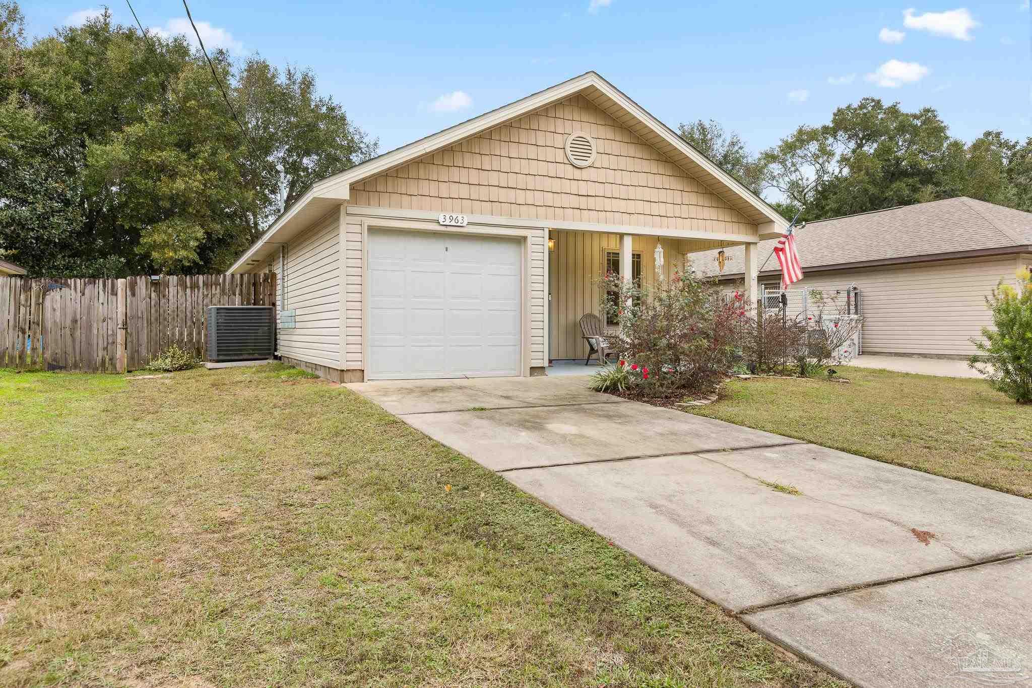 a view of a house with a yard