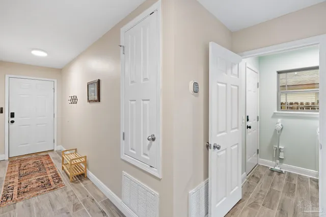 a view of room with window and hardwood floor