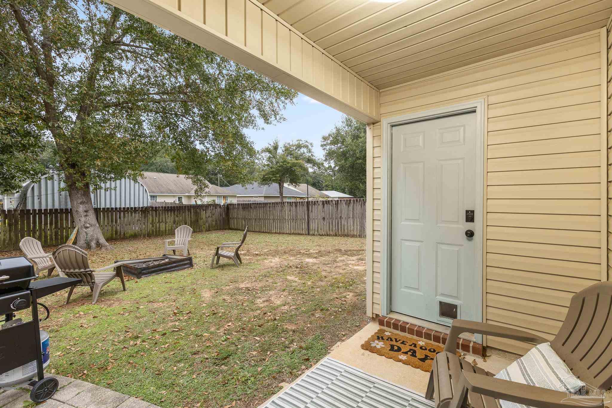 3963 Edgefield Street Pace, FL 32571 - Photo 22 of 30 a outdoor view with a sitting space
