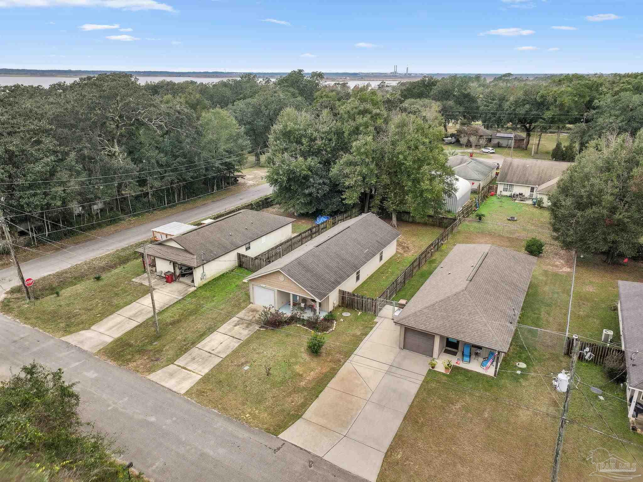3963 Edgefield Street Pace, FL 32571 - Photo 25 of 30 an aerial view of a house with a yard basket ball court and outdoor seating