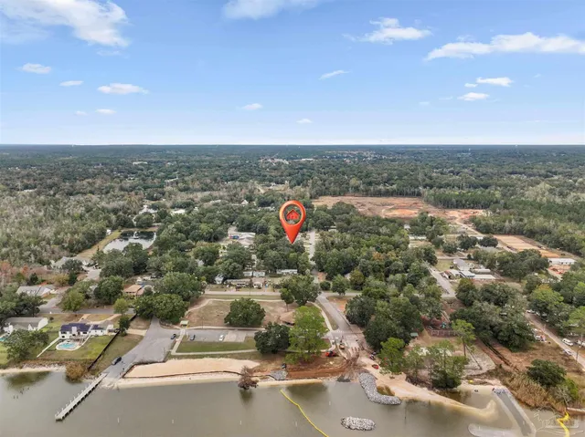 an aerial view of residential houses with city view