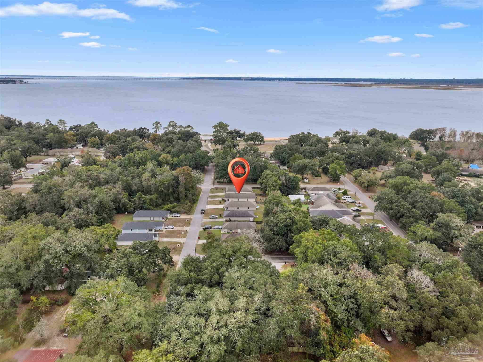 3963 Edgefield Street Pace, FL 32571 - Photo 28 of 30 an aerial view of a houses with a yard