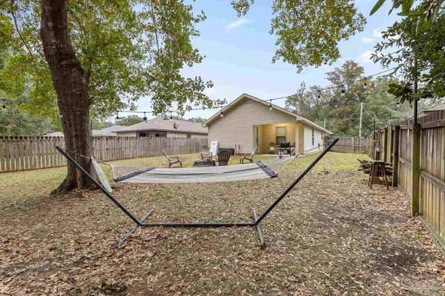 a house with trees in the background