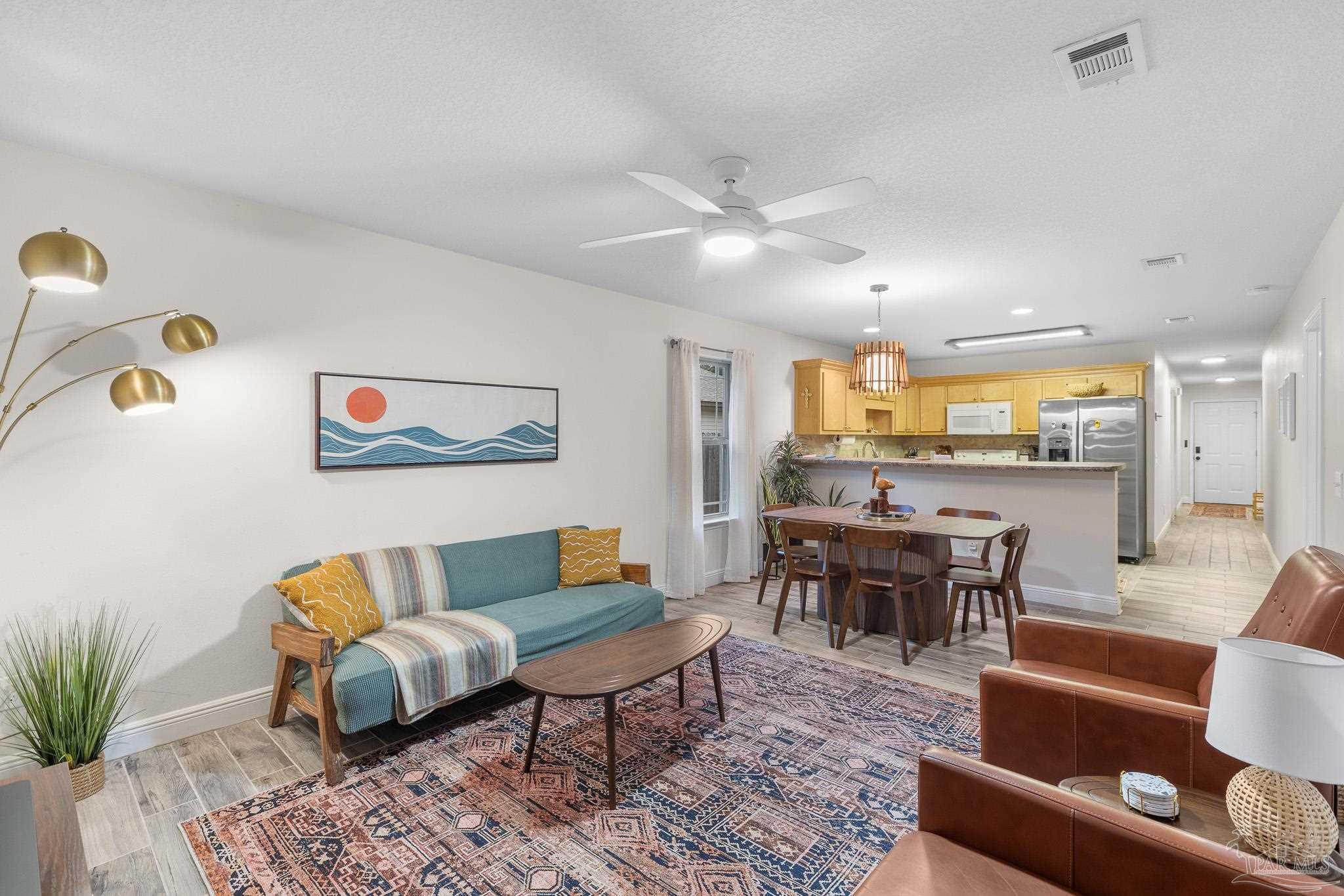 3963 Edgefield Street Pace, FL 32571 - Photo 4 of 30 a living room with furniture and wooden floor