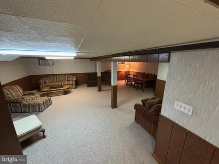 a room with furniture and a flat screen tv