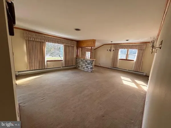 a view of empty room with windows