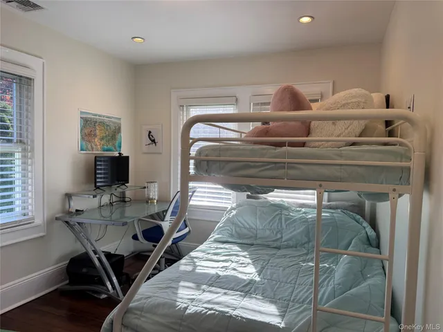 a bedroom with a bed and a table