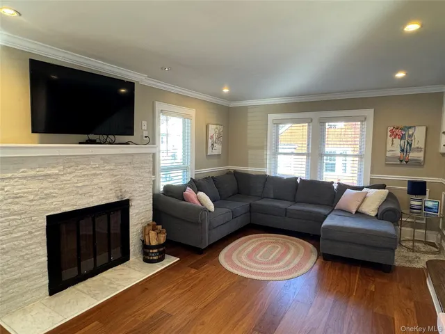 a living room with furniture fireplace and flat screen tv