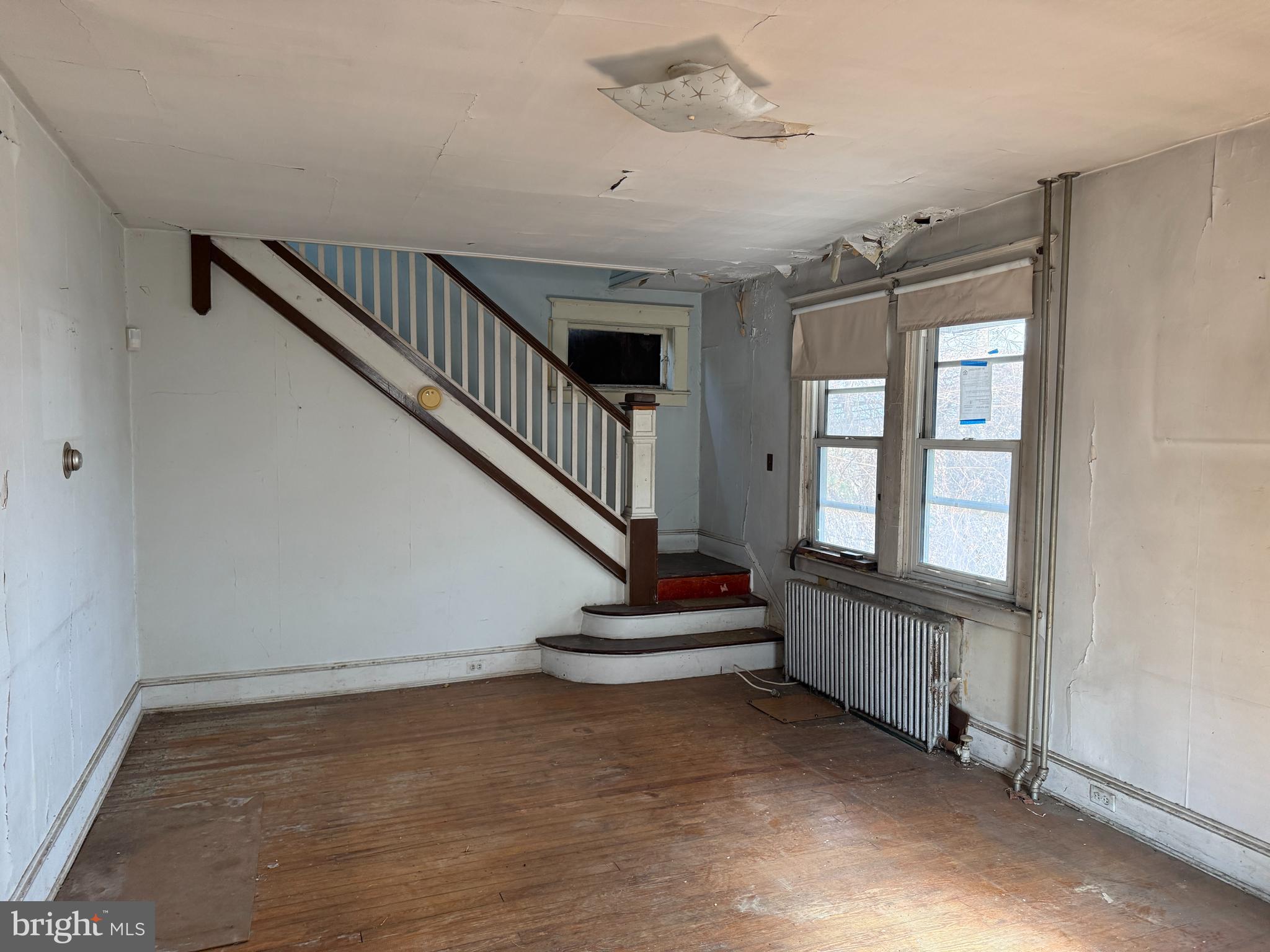900 North Point Road Baltimore, MD 21224 - Photo 3 of 12 a view of entryway with stairs and wooden floor