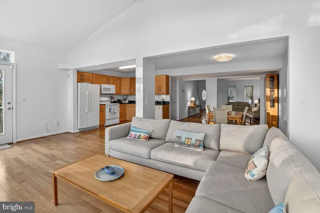 a living room with furniture and a table