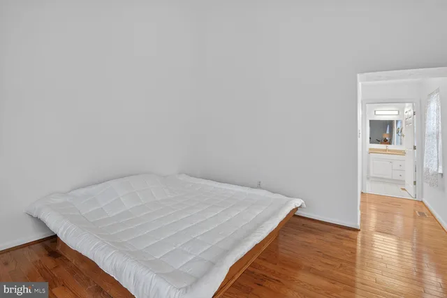 an empty room with wooden floor