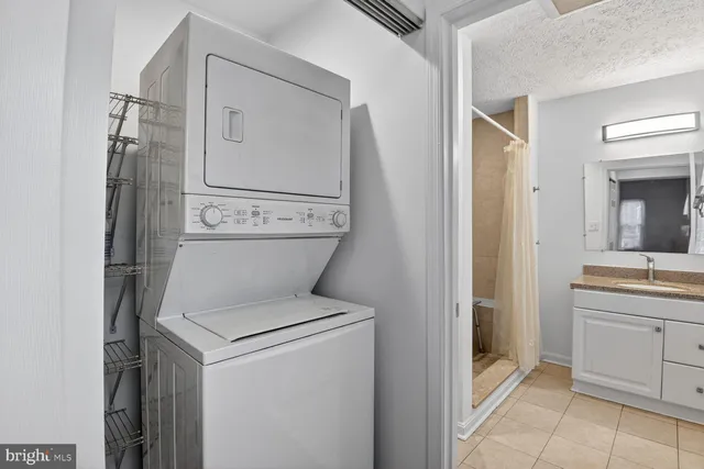 a view of bathroom with a toilet sink and a mirror