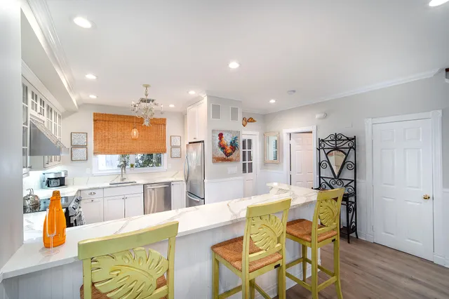 a kitchen with a sink stove and window