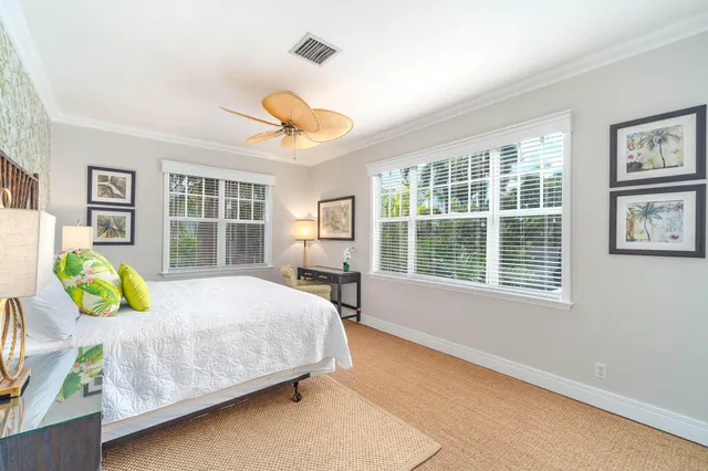 a view of a hallway with furniture and a window