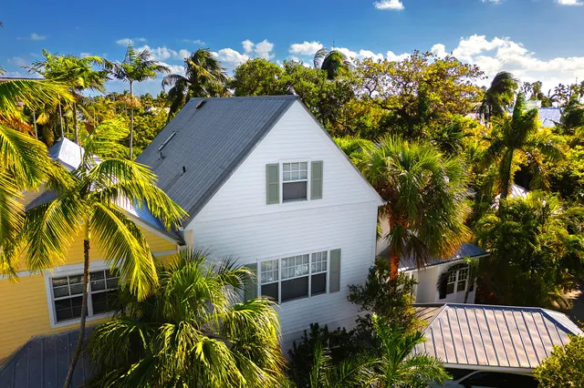 a front view of a house with outdoor seating