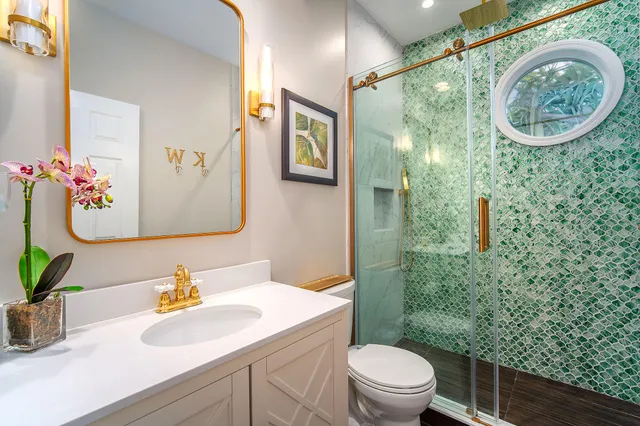 a bedroom with a bed and painting on the wall