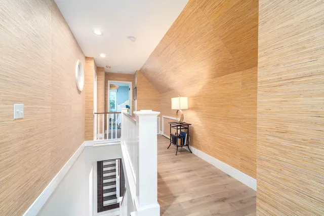 a bedroom with two beds and a window