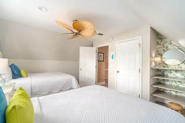 a bedroom with bed and a large window