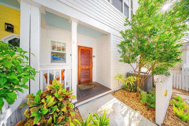 an aerial view of a house with swimming pool garden and patio