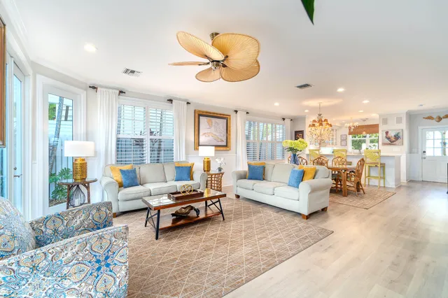 a view of a patio with table and chairs under an umbrella