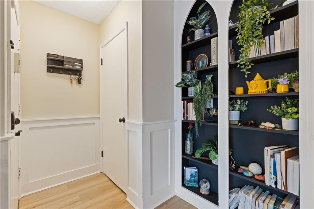 6851 Roswell Road, Unit N9 Atlanta, GA 30328 - Photo 2 of 16 a view of a livingroom with wooden floor and entryway