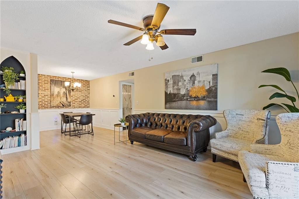 6851 Roswell Road, Unit N9 Atlanta, GA 30328 - Photo 4 of 16 a living room with furniture