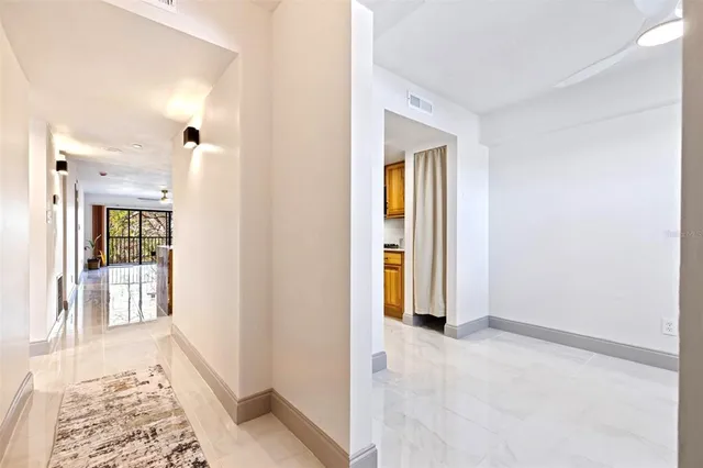 a living room with lots of furniture and a rug