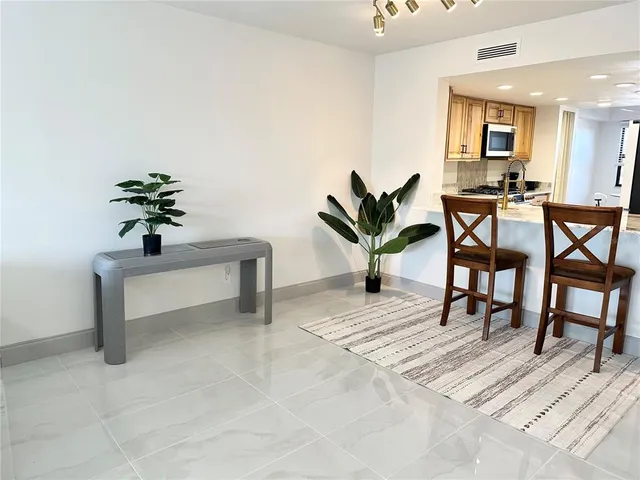 a bed room with a bed and a large window