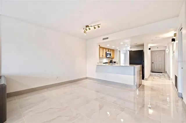 a bedroom with bed and a large window