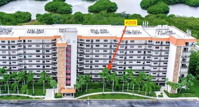 a open kitchen with stainless steel appliances granite countertop a stove and a sink