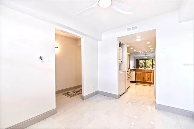 a bathroom with a sink a toilet a mirror and shower