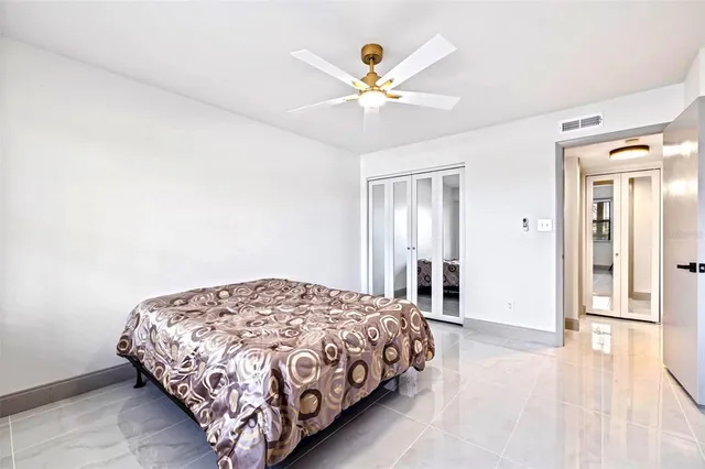 an aerial view of a house with a yard and lake view