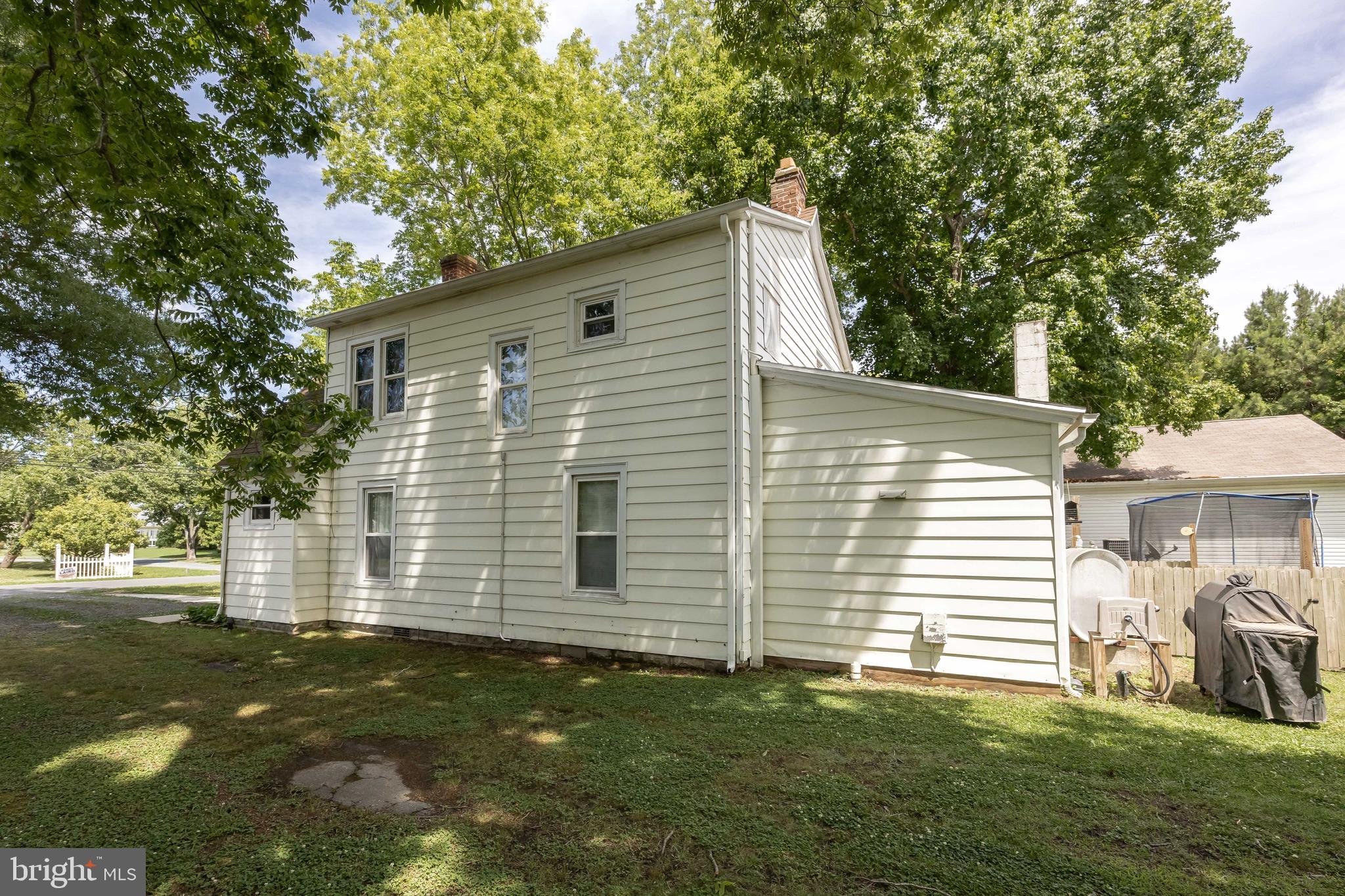 26467 Mariners Road Crisfield, MD 21817 - Photo 6 of 44 a front view of a house with a yard