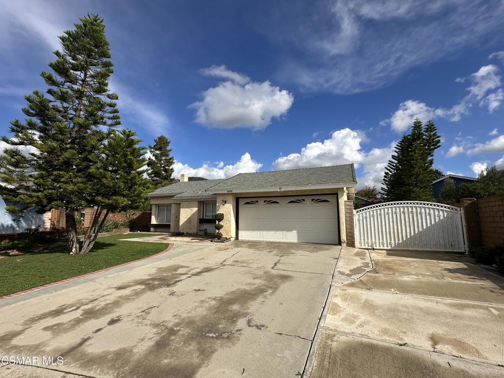 6495 Hope Street Simi Valley, CA 93063 - Photo 1 of 33 a view of a house with a yard and garage