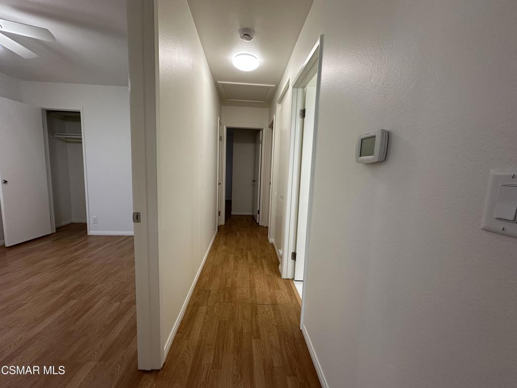 6495 Hope Street Simi Valley, CA 93063 - Photo 15 of 33 a view of a hallway with wooden floor
