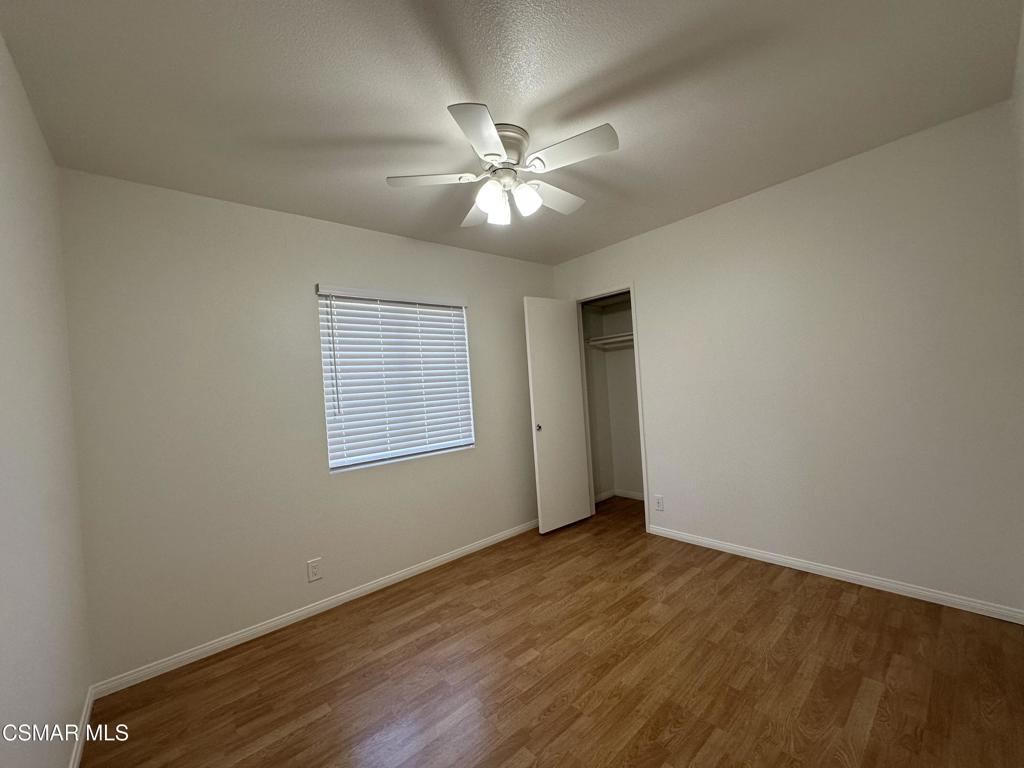 6495 Hope Street Simi Valley, CA 93063 - Photo 17 of 33 a view of an empty room with window and wooden floor